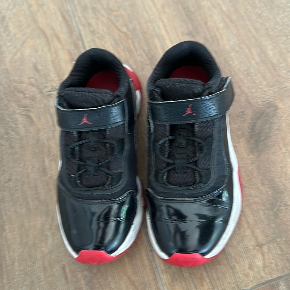 Micheal Jordon boys running shoes. Size 13C. Color black with red/white accent.